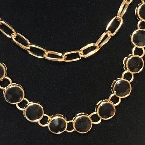 Linked gold and black stone necklaces